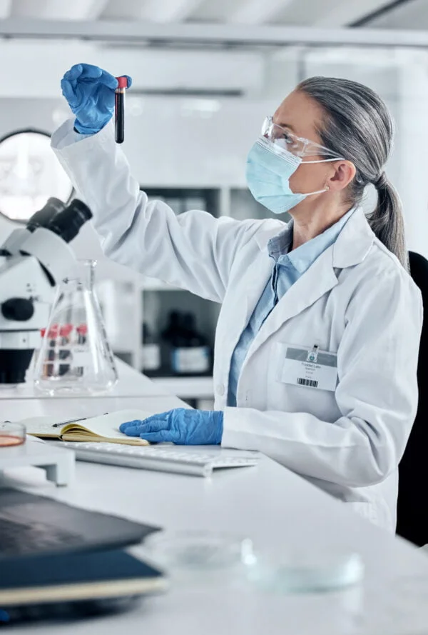 Scientist, pathology and blood or DNA science woman working in a lab for covid research, innovation African American stylish woman smiling on a phone call surrounded by pink roses in the garden