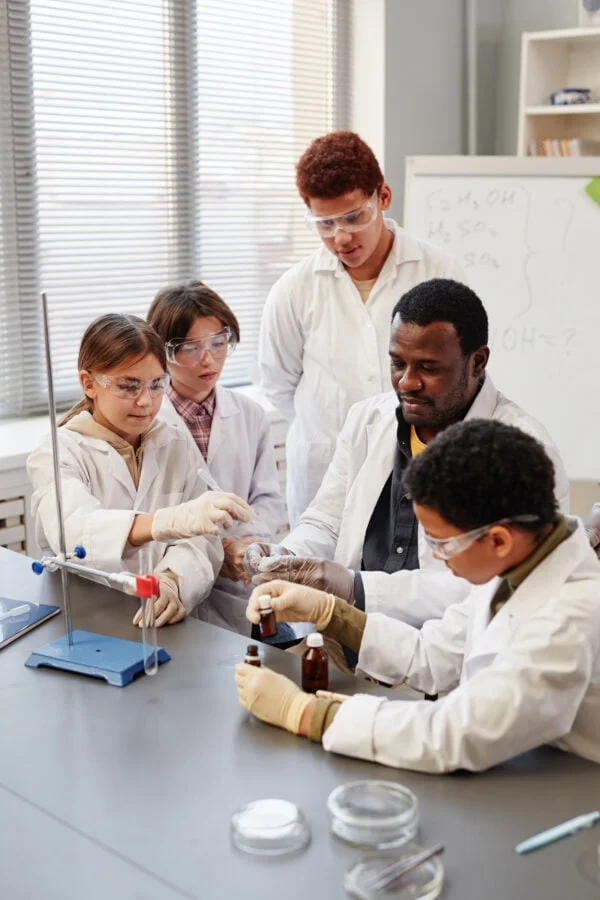 Teacher Showing Experiment in Science Lab Steam Train